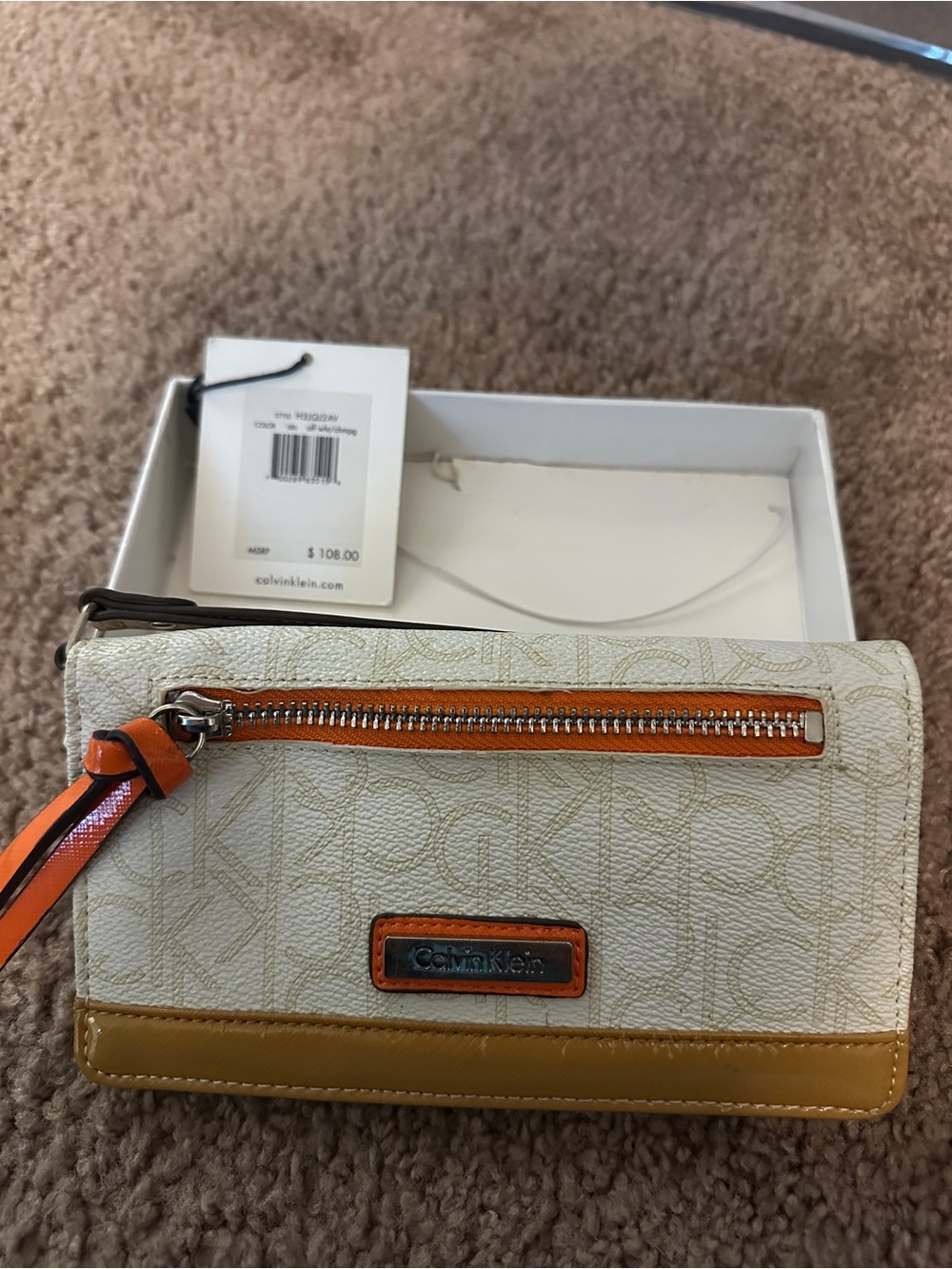 Calvin Klein Cream Wristlet with Tan Trim and Orange Accents